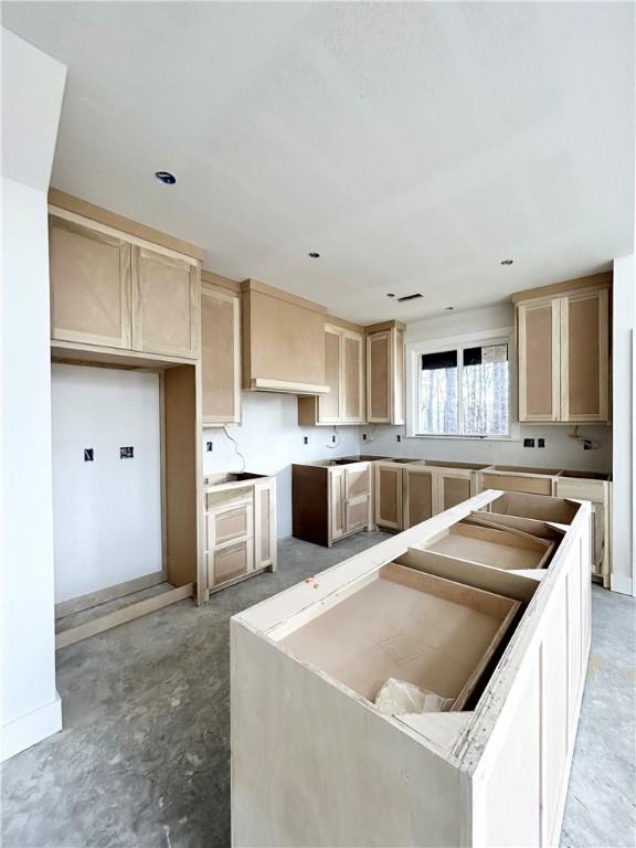 kitchen featuring light brown cabinets