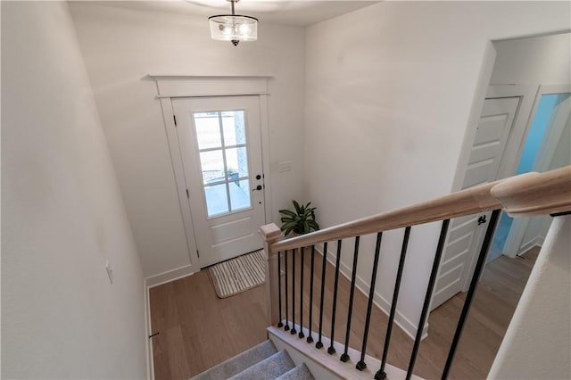 entrance foyer with wood finished floors and stairs