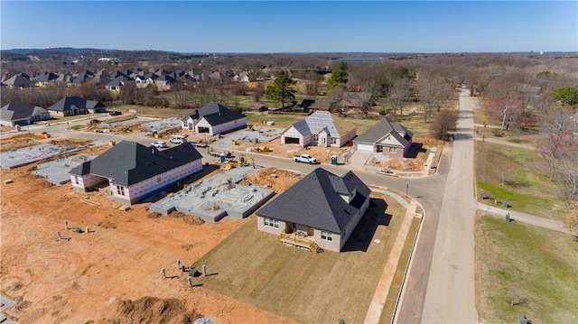 birds eye view of property with a residential view