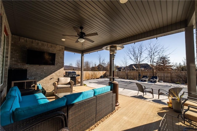 view of patio featuring outdoor lounge area, a grill, and ceiling fan