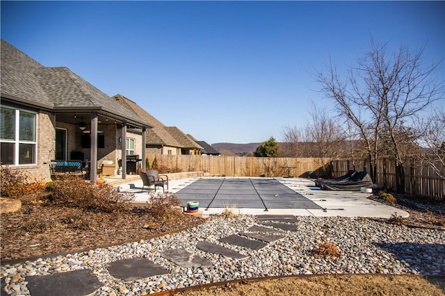 view of swimming pool featuring a patio area