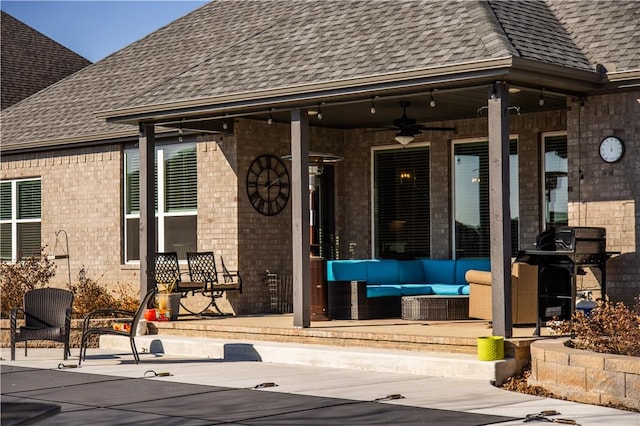 exterior space featuring a patio, outdoor lounge area, and ceiling fan