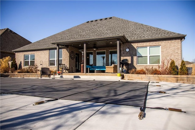 back of house with an outdoor hangout area, a patio area, and ceiling fan