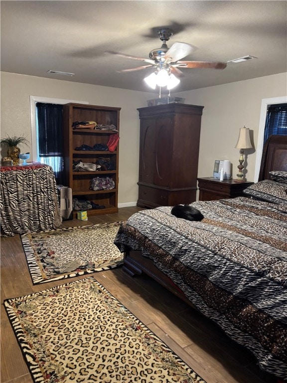 bedroom featuring hardwood / wood-style floors and ceiling fan