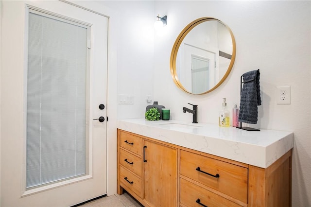 bathroom featuring tile patterned flooring and vanity