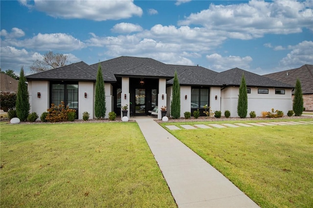 prairie-style house with a front lawn