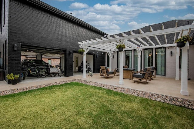 rear view of house with a yard, a patio area, and a pergola