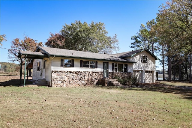 view of front of property with a garage and a front yard