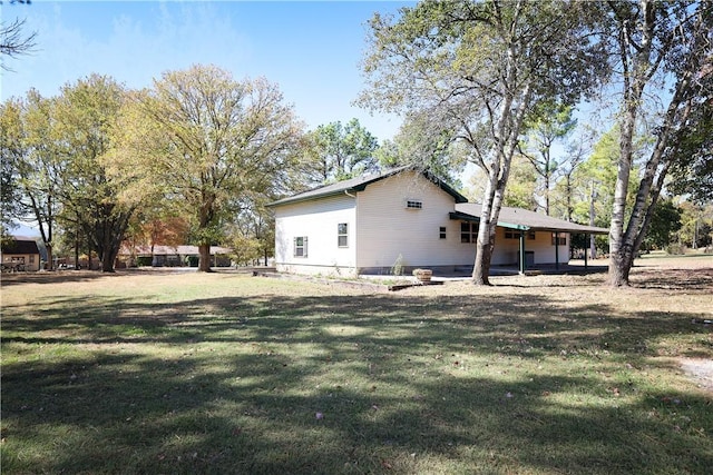 view of property exterior featuring a lawn