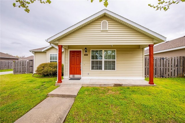 bungalow-style home with a porch and a front yard