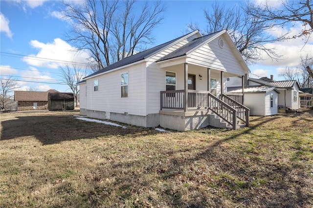 view of front of home with a porch and a front yard