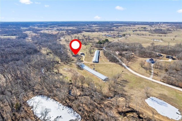 birds eye view of property with a rural view