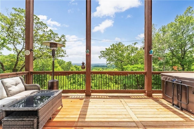 wooden terrace featuring outdoor lounge area