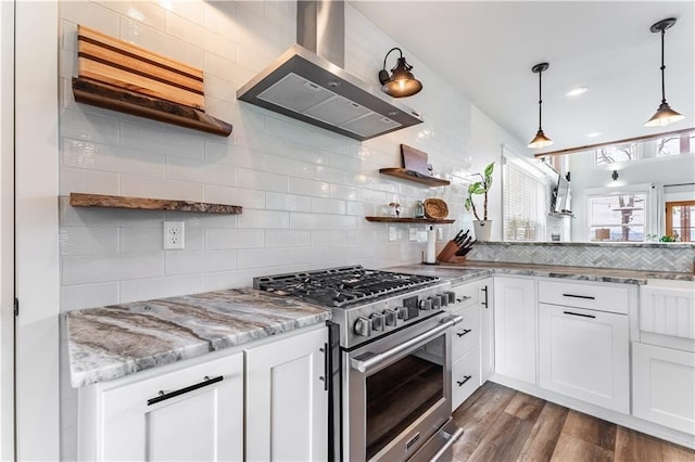 kitchen featuring high end stainless steel range oven, white cabinetry, and island range hood