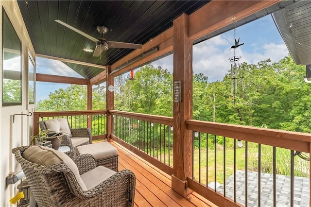 wooden terrace featuring ceiling fan