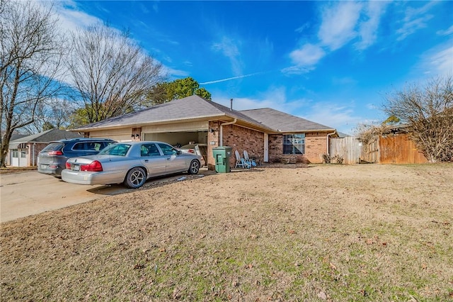 view of front of property with a garage and a front yard