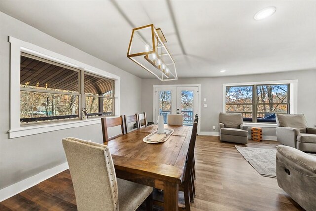 dining area with french doors and hardwood / wood-style flooring