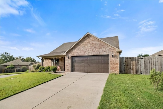 view of front facade with a garage and a front lawn