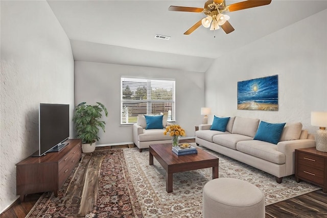 living room with hardwood / wood-style floors, vaulted ceiling, and ceiling fan