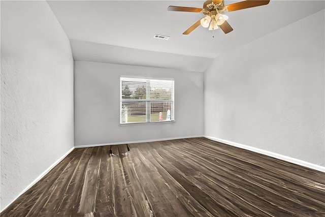 empty room with hardwood / wood-style floors, vaulted ceiling, and ceiling fan