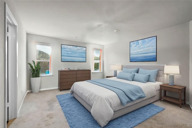 carpeted bedroom featuring multiple windows