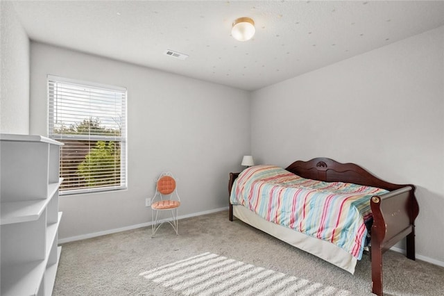 bedroom with light colored carpet