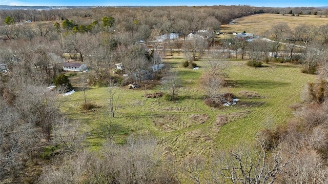 birds eye view of property featuring a rural view