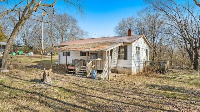 exterior space featuring a front lawn