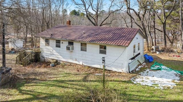 view of home's exterior with a yard and cooling unit