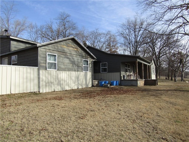 view of property exterior featuring a lawn