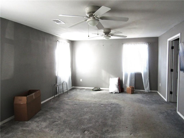 unfurnished room with dark carpet