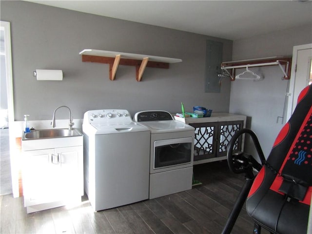 washroom featuring separate washer and dryer, sink, and dark hardwood / wood-style floors