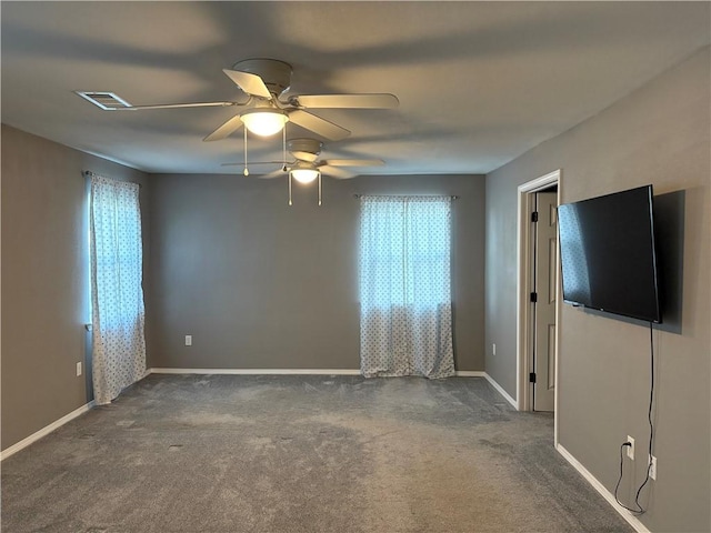 interior space featuring visible vents, ceiling fan, and baseboards