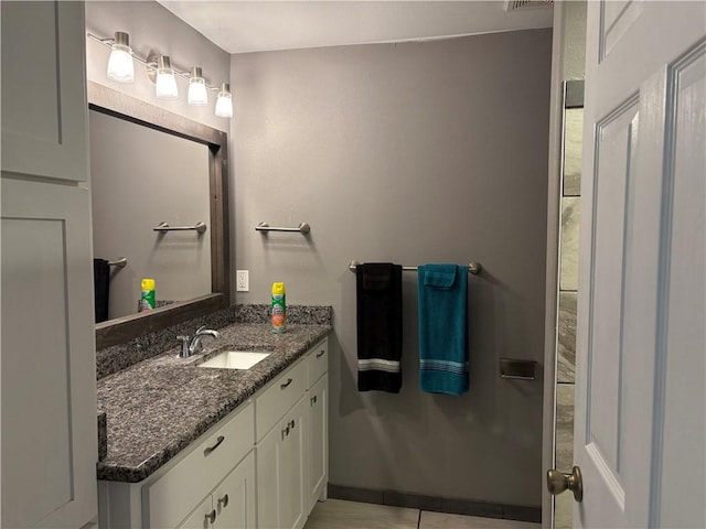 bathroom featuring tile patterned floors and vanity