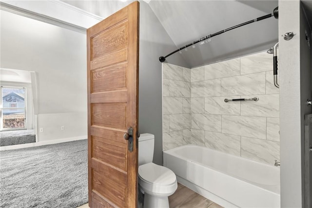 bathroom featuring shower / bathtub combination and toilet