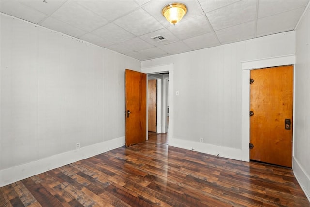 empty room featuring dark wood-type flooring
