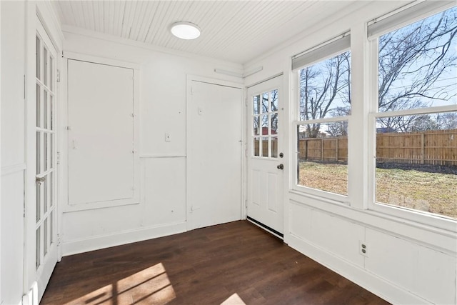 interior space with dark hardwood / wood-style flooring and a wealth of natural light