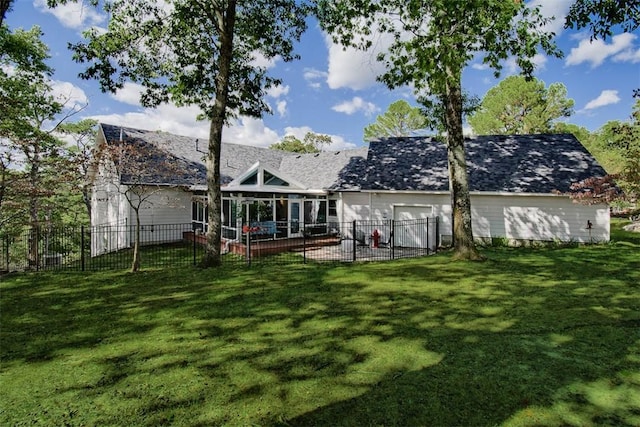 rear view of property featuring a patio, a sunroom, and a yard