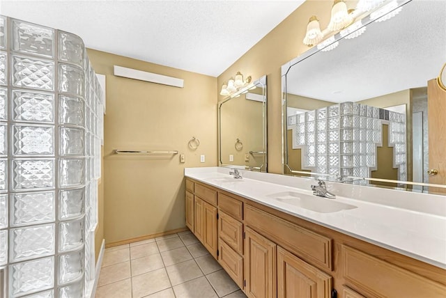 bathroom with vanity, tile patterned floors, and a textured ceiling