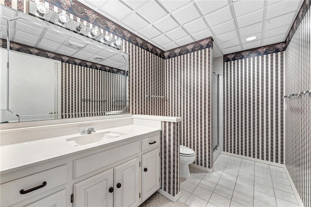 9 Marykirk Ln, Bella Vista, AR 72715 - bathroom with wallpapered walls, toilet, a shower stall, vanity, and baseboards
