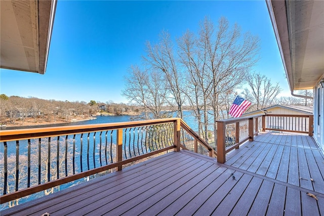 wooden deck with a water view