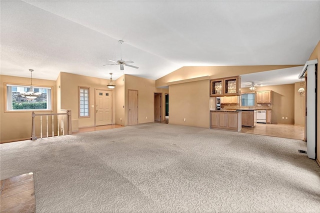 9 Marykirk Ln, Bella Vista, AR 72715 - unfurnished living room with a ceiling fan, lofted ceiling, light colored carpet, and baseboards