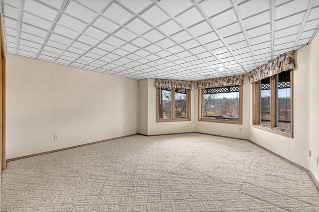 spare room featuring light colored carpet