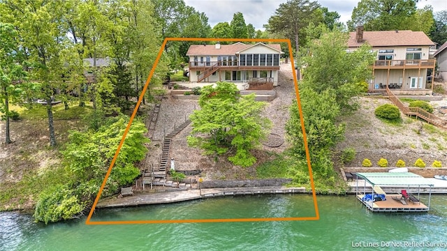 9 Marykirk Ln, Bella Vista, AR 72715 - back of house with stairs, a deck with water view, and a chimney