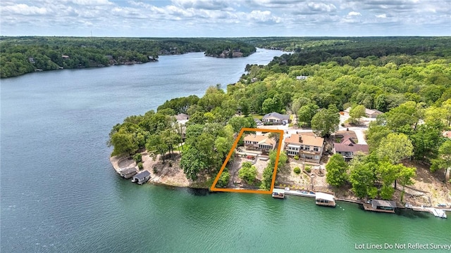 9 Marykirk Ln, Bella Vista, AR 72715 - aerial view of property's location with a heavily wooded area, property boundaries highlighted, and a nearby body of water