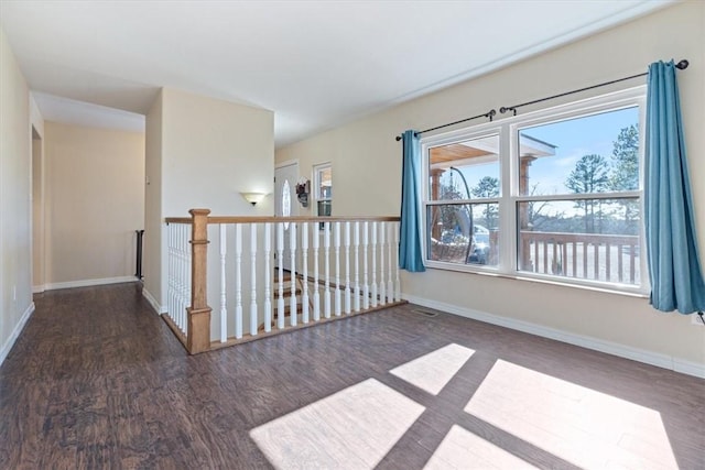 empty room featuring dark hardwood / wood-style floors