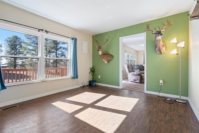 unfurnished room featuring dark hardwood / wood-style floors