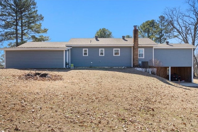 rear view of property featuring cooling unit