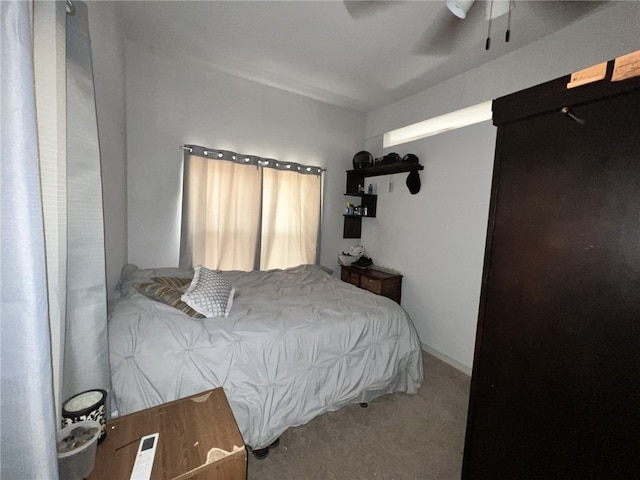 bedroom with ceiling fan and carpet flooring