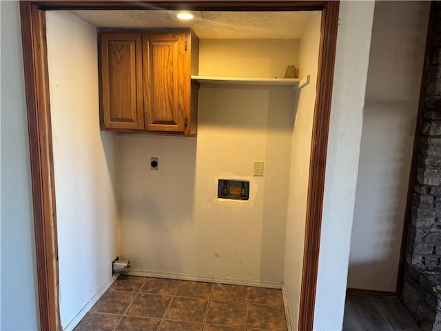 laundry area with cabinets and electric dryer hookup